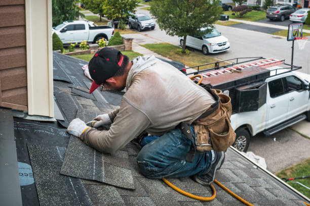 Professional Roofing technician working in North Chili, NY